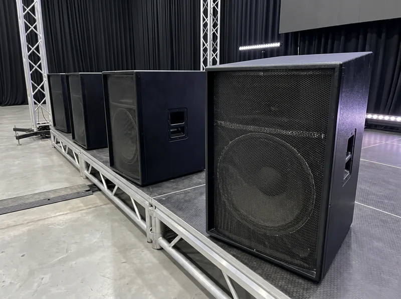 Professional speakers set up on a stage